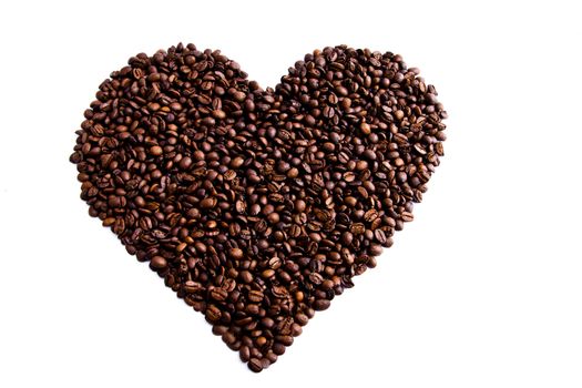 A love heart made of dark roasted coffee beans