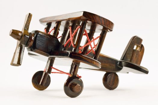 A wooden toy aeroplane isolated with clipping path