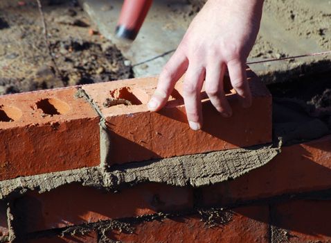 Close up of bricklayer at work 