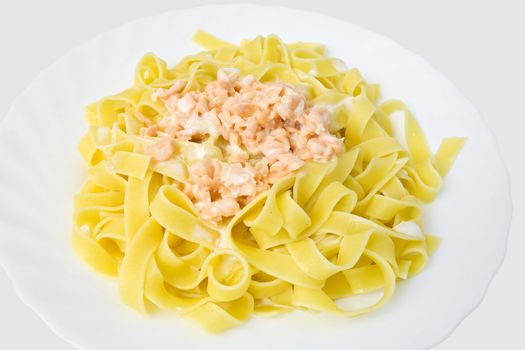typical dish of italian cooking: penne with tomato sauce isolated on white background