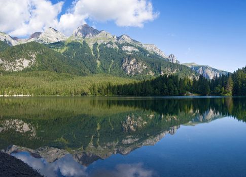 summer view of a beautiful lake in Italian alps