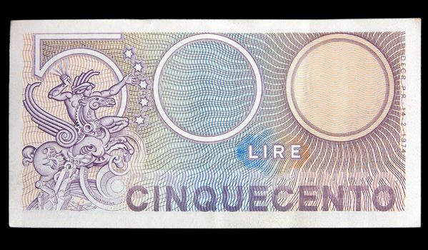 five hundred lire Italian banknote isolated on black background