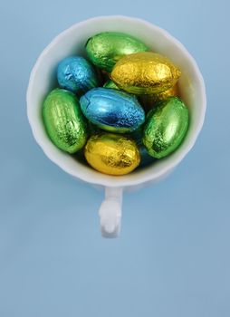 easter eggs in white cup