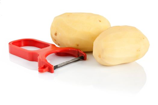 plastic potato pealer and two peeled potatoes isolated on white background