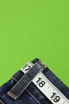 Jeans with measuring tape belt