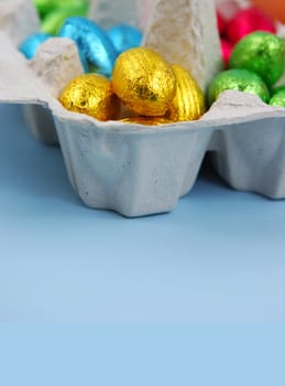 Foil Covered Easter Eggs in Egg Carton
easter chicks on blue background