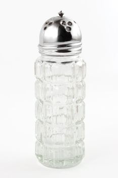 Glass salt dispenser isolated on white background