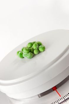 Frozen peas on weighing scale