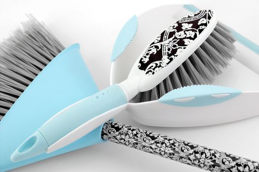 Blue patterned dustpan & brush on white background