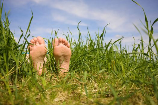 Barefooted a foot in a years grass