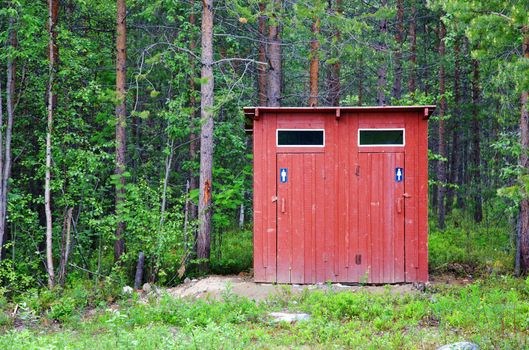 Public toilet in a wood