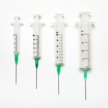 Four different on capacity of a syringe on a white background