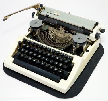 Old ancient typewriter on a white background