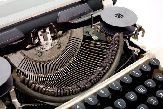 The alphabet of a typewriter close up on a white background