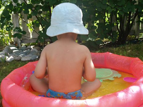 baby bathing in garden