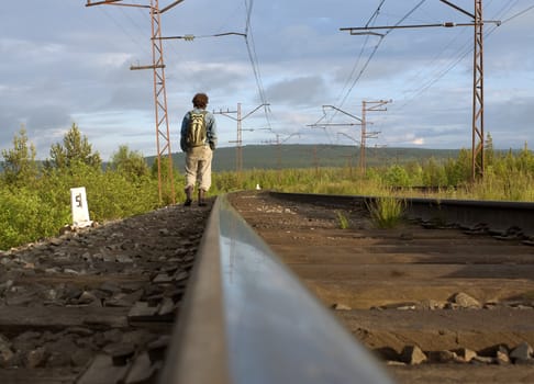 The guy leaving afar by rail