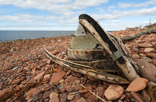 The old, broken boat on seacoast