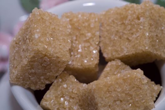 close-up of cup full of brown sugar