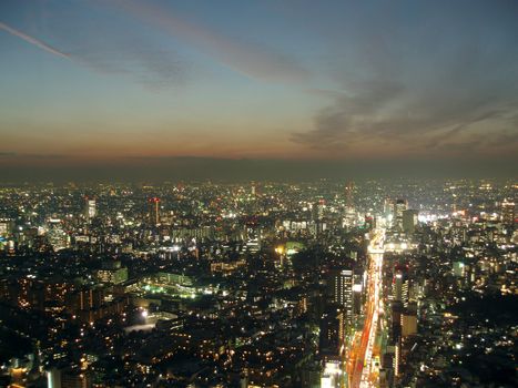 a view of tokyo from above at dusk