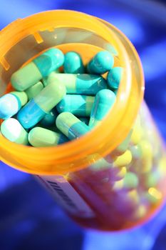 Medicine, pills against blue background