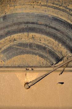 The dirty back window of an off-road sport utility vehicle.  Background image for off-roading adventure.
