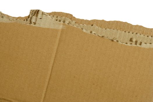 Torn section of a corrugated shipping carton. Background for writing / shipping.
