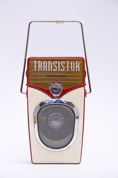 A retro transistor radio isolated over white 