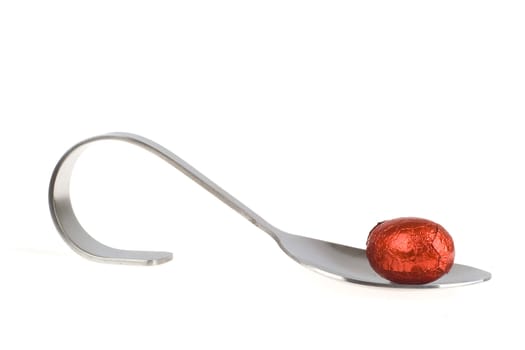 one appetizer spoon with a chocolate eggs