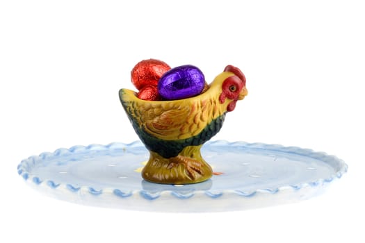 chocolate eggs in a egg cup with a plate