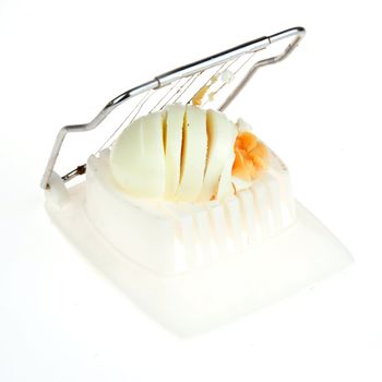 a boiled egg in a egg-cutter