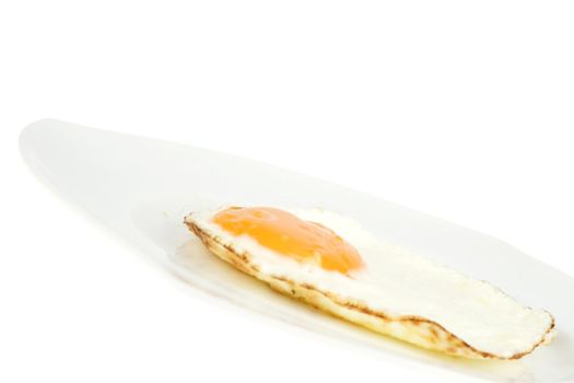 a fried egg on a white plate