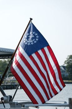 Red, white, and blue United States boat flag.