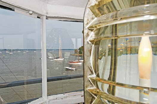 View from inside lighthouse tower overlooking harbor and yachts.