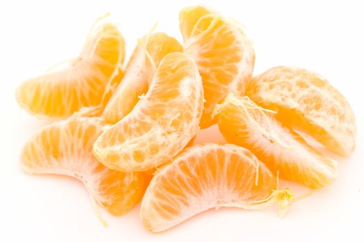 some tangerine segments on a white background
