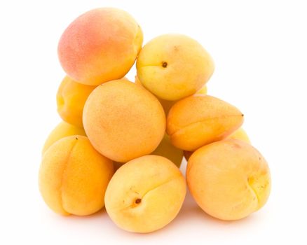 Some ripe apricots on on a white background