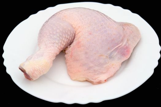 Raw chicken meat on a white background.