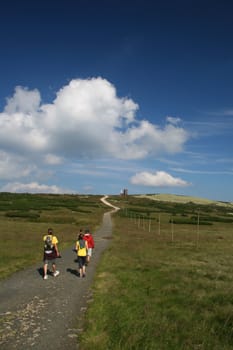 mountain landscape, beautiful summer weather, blue sky, tourists