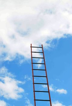 View of builders ladder against cloudy blue sky