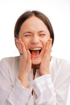 Closeup portrait of a happy surprised young woman on white background