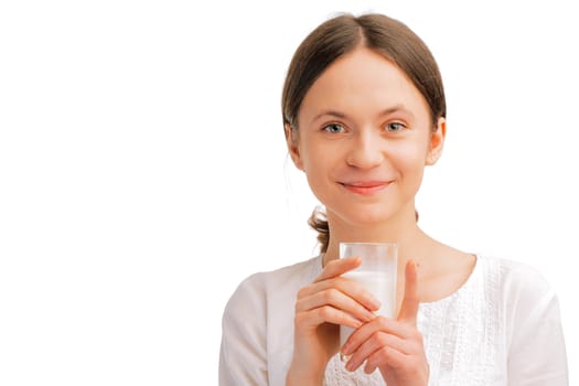 Portrait of beautiful woman holding glass of milk