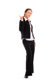 Full length of a smiling young business woman pointing up at copyspace 