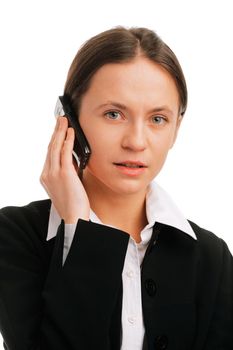 Serious businesswoman  talking on mobile phone against white background