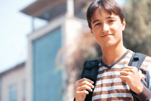 Young man with bag in the town
