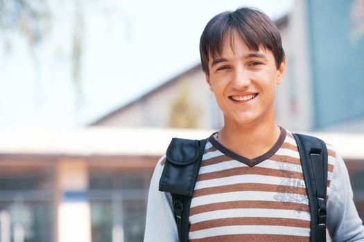 Young man with bag in the town