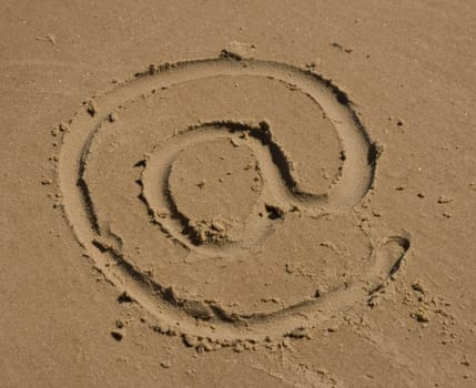 At sign, email sign on the sand