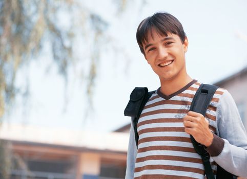 Young man with bag in the town