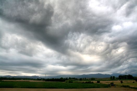 stormy weather at the countryside, dark clouds, landscpae background