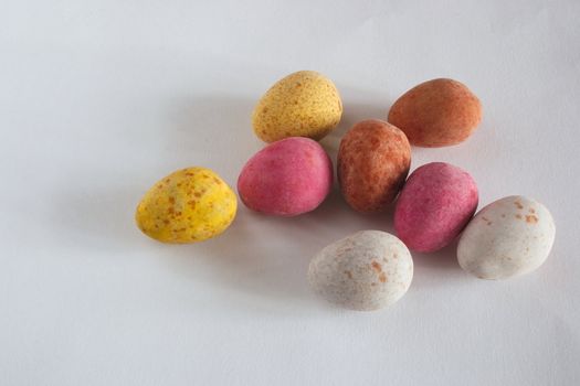 mini eggs in a cluster against a light background