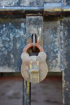 Close-up of an old lock on a gate