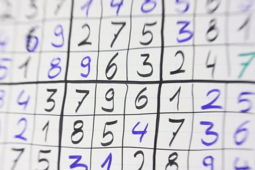 selective focus photo of selfmade sudoku game on flipchart paper